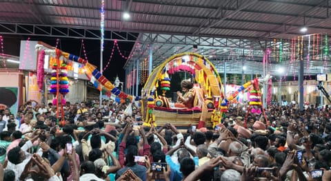 Devotees throng the Dharmapuram Adheenam's grand Pattina Pravesam procession in Mayiladuthurai on Monday.