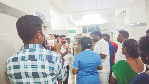 Sholinganallur MLA ECR P Saravanan meets patient’s husband and doctors at the Kannagi Nagar UCHC on Tuesday night