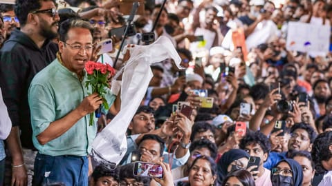 Activist Sonam Wangchuk greets a gathering during a protest staged by Cockroach Janta Party and other organisations, demanding the resignation of Union Education Minister Dharmendra Pradhan over the NEET paper leak and the irregularities related to the CBSE's on-screen marking system, at Dharna Chowk, in Hyderabad, Telangana, Sunday, June 14, 2026
