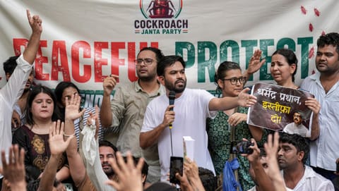 Cockroach Janta Party (CJP) founder Abhijeet Dipke, centre in white, addresses the gathering as its spokesperson Ashutosh Ranka, back centre, looks on during a protest demanding the resignation of Union Education Minister Dharmendra Pradhan over alleged examination-related lapses, at the Jantar Mantar