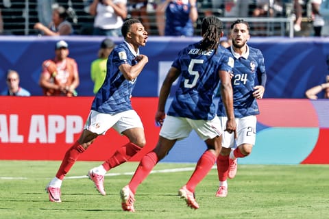 A moment of joy as France's players come together to celebrate a decisive strike.