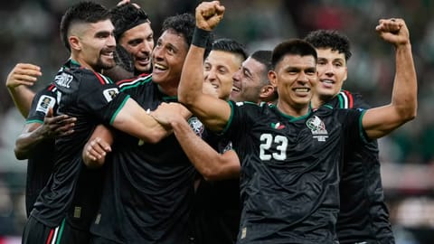 Mexico's Luis Romo, third left, celebrates with his teammates after scoring g his team's first goal during the World Cup Group A