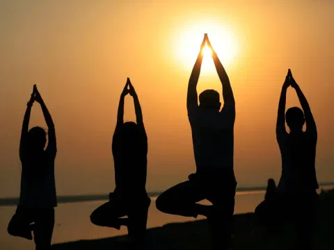 People practice Yoga on the eve of International Yoga Day 2026, in Prayagraj on Saturday.