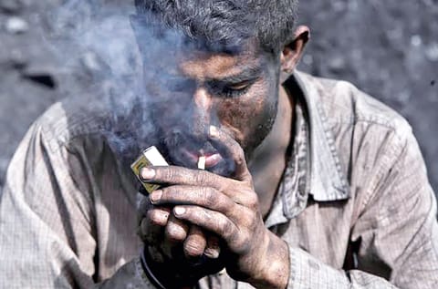 man smoking bedi
