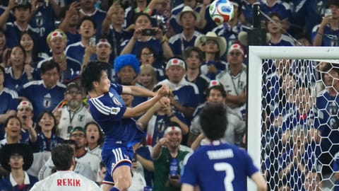 1 of 5 Japan's Ayase Ueda, center, scores their fourth goal with a header against Tunisia during the World Cup Group F soccer match