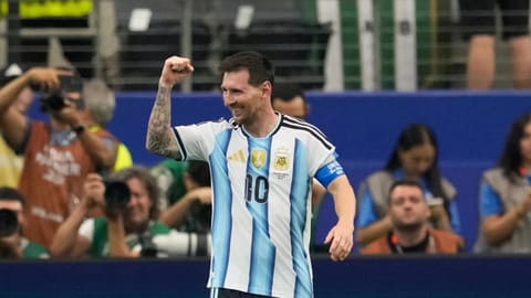 Argentina's Lionel Messi celebrates scoring his side's second goal against Austria during the World Cup Group J soccer match in Arlington, Texas