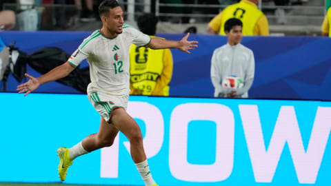 Algeria's Nadhir Benbouali (12) celebrates after scoring a goal during the World Cup Group J soccer match between Jordan and Algeria in Santa Clara