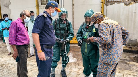 National Disaster Response Force (NDRF) personnel arrive at a seafood export unit following an ammonia gas leak, in Manjangaranai, Tiruvallur