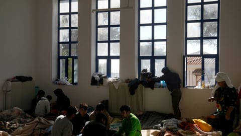 Migrants, most of them from Afghanistan, rest at an old school used as a temporary shelter on the island of Kythira, southern Greece