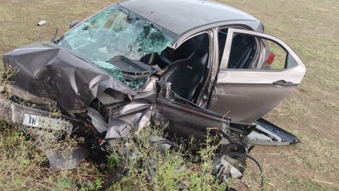 Mangled remains of the car that crashed into a roadside tree on  Tenkasi-Madurai National Highway early Tuesday