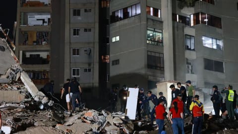 Rescue workers search through the rubble after an earthquake in Caracas, Venezuela