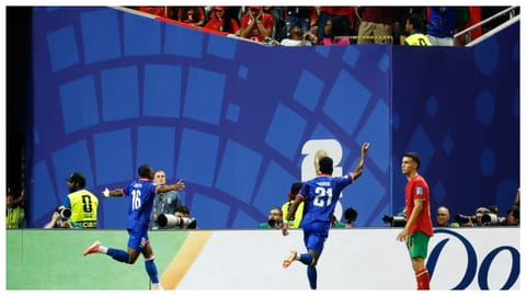 Haiti's Lenny Joseph (16) celebrates after Morocco goalkeeper Yassine Bounou scored an own goal during the World Cup Group C soccer match between Morocco and Haiti in Atlanta.