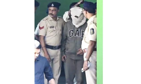 One of the Luthra brothers, co-owners of the Birch by Romeo Lane nightclub, being taken by police personnel to a court in connection with the December 6 fire incident that killed 25 persons, at Anjuna police station, in North Goa district, Wednesday, Dec. 17, 2025