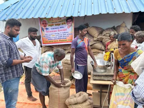 Cooperation Department staff distributing ration to villagers in Nekkanamalai bought by  BJP youth wing cadre uphill recently in Tirupattur district