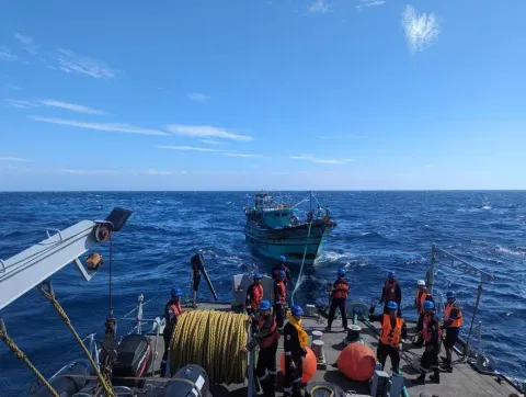 INS Khanjar rescuing stranded fishermen in the Bay of Bengal