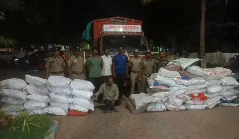 The accused with sandalwood found in secret chamber of the truck