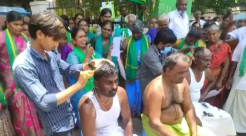 Farmers tonsuring their heads in protest against HR&amp;CE move in Tirupur on Thursday