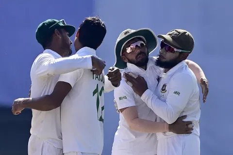 Bangladesh’s cricketers celebrate after winning the first Test