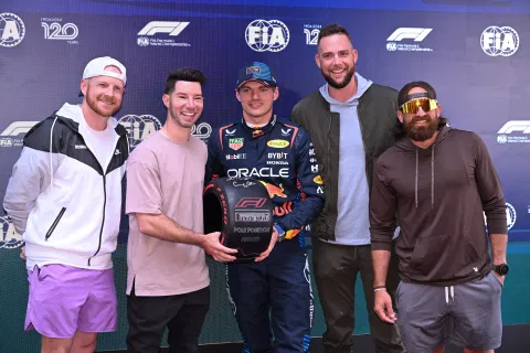 Max Verstappen (C) poses with members of comedy group Dude Perfect