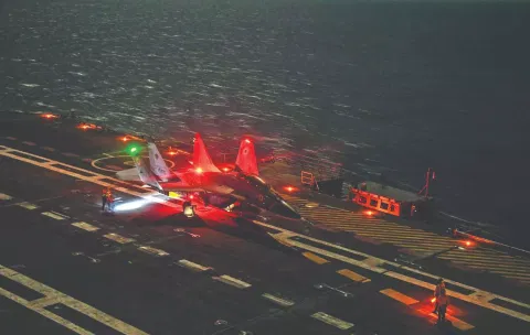 A MiG-29K aircraft on the deck of INS Vikrant after making the maiden night landing.