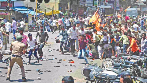 Security personnel disperse people protesting against the alleged use of Tipu Sultan’s image in an objectionable social media post, in Maha’s Kolhapur district, on Wednesday
