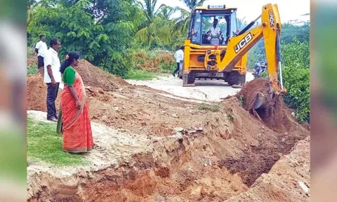 Krishnaveni Jalandhar, vice chairman, Vellore district panchayat, digging trenches in Malattar