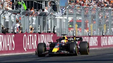 Red Bull’s Max Verstappen passes the chequered flag to win the Hungarian Grand Prix