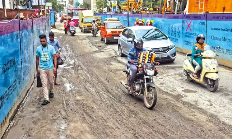 Pedestrians are forced to walk along side motorists as there is no platform to walk on