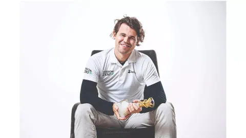 Magnus Carlsen is all smiles after his victory