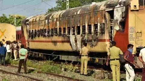 Security personnel at the spot after a fire broke out in a coach of a train at Madurai railway station, Saturday (Photo/PTI)