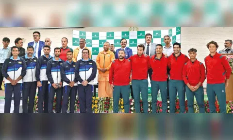 UP CM Yogi Adityanath along with players of both the teams at the Davis Cup matchday draw ceremony on Friday
