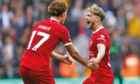 Harvey Elliott celebrates after his deflected shot makes it 3-1 for Liverpool