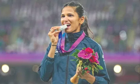 Jyothi Yarraji with the silver medal after her hard-fought victory