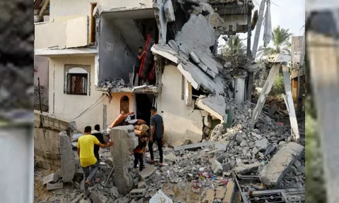 Palestinians carry out belongings from a damaged house in Gaza Strip (ANI)