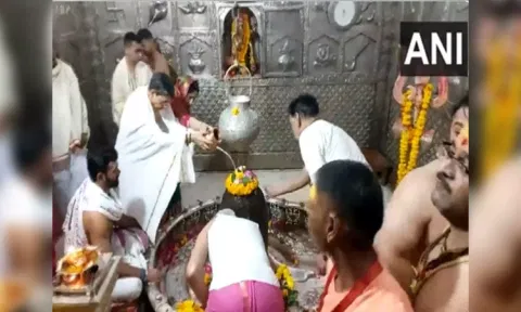 Tamil Nadu governor R N Ravi performing Jalabhishek to Baba Mahakal along with his wife
