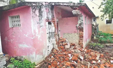 The demolished portion of the dilapidated toilet in Tholapalli village in Anicut panchayat union.