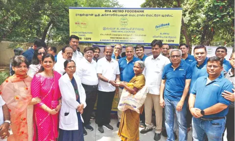 Subramanian handing over lunch token to an attendant.