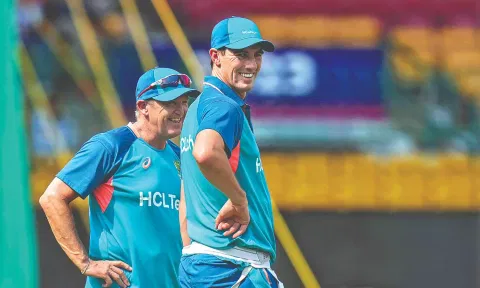 Australia’s captain Pat Cummins with support staff Andy Flower.