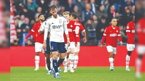 A dejected Branco van Boomen walks back after PSV scored a goal during their Dutch Eredivisie match