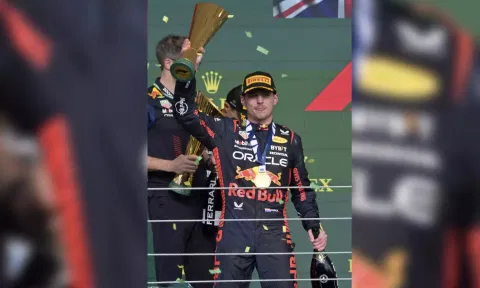 Max Verstappen atop the podium after winning the F1 Brazil GP