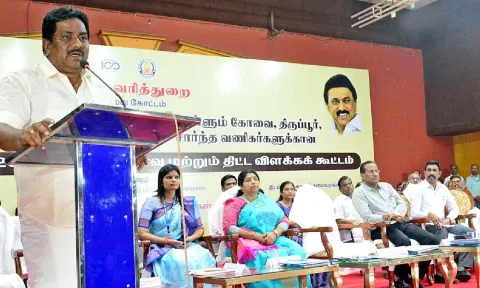 Minister P Moorthy addressing a traders’ meeting in Coimbatore on Tuesday