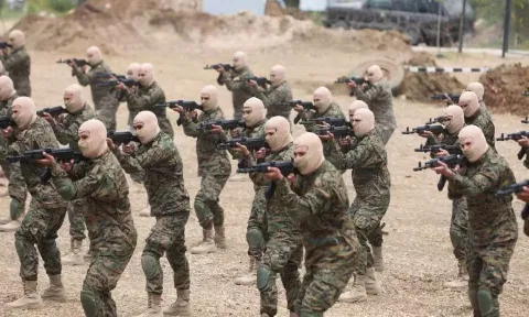 Hezbollah members take part in a military exercise