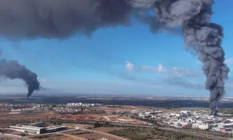 Smoke is seen in the Rehovot area as rockets are launched from the Gaza Strip, in Israel. (Reuters)