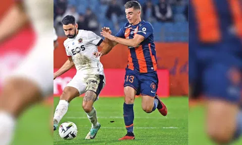 Montpellier’s Joris Chotard fights for the ball with Morgan Sanson in their match