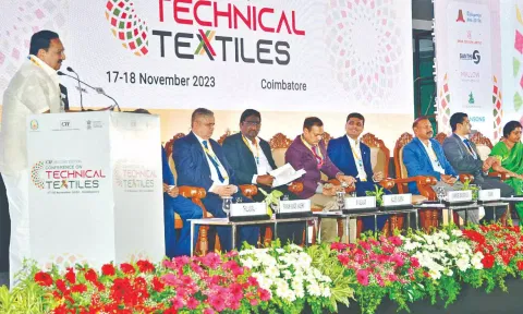 Minister for Handlooms and Textiles R Gandhi addressing a conference in Coimbatore on Friday