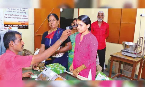 PDS staff scanning the iris of a customer at an outlet in Vellore