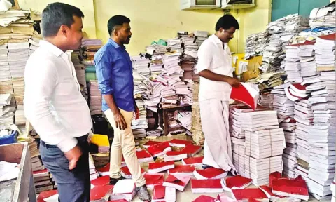 Egmore MLA I Paranthaman inspecting government records, land registration records and marriage registry at Periamet sub-registrar office on Monday