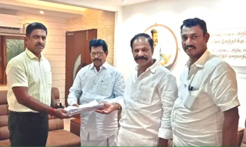 Vellore DMK president Saqhy, MLA Karthikeyan handing over the list to Collector P Kumaravel Pandian on Tuesday&nbsp;