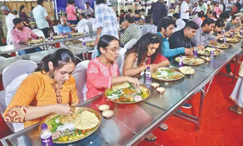People enjoying sabha food served by Arusuvai Arasu Catering Services. (Photo credits: Manivasagan N)