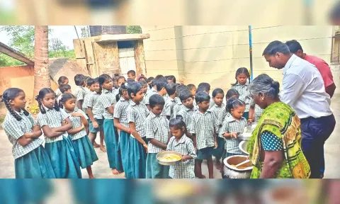 Children get their breakfast at the government-aided school in Thenpalli of Katpadi taluk.